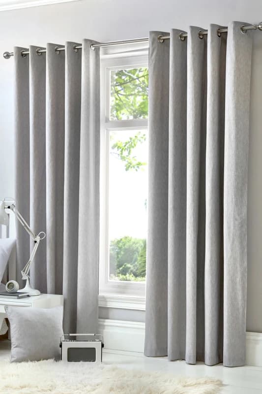 Fusion 'Cannes' 100% Cotton Black Out Plain Dyed Eyelet Curtains in Silver Size: 117cm width x 183cm drop Silver Unisex 117cm width x 183cm drop