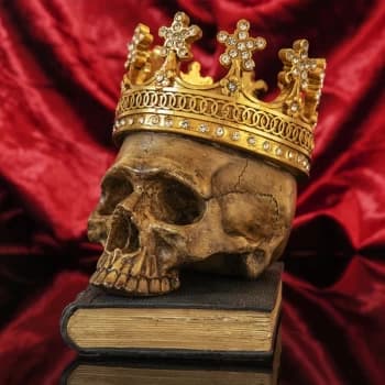 Hand Painted Skull with Crown Resting On A Book Ornament
