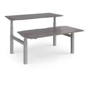 Elev8 Touch sit-stand back-to-back desks 1600mm x 1650mm - silver frame and grey oak top