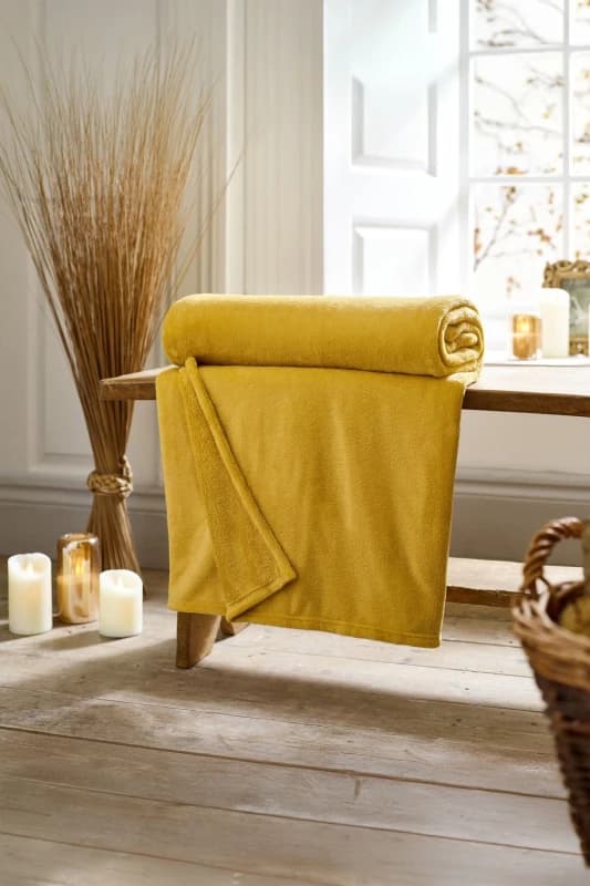Deyongs Deyongs Snuggle Touch Super Soft Solid Colour Fleece Throw in Yellow Size: 140cm x 180cm Yellow 140cm x 180cm Unisex 5054990142580
