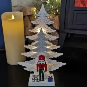 25cm LED Battery Operated Nutcracker with White Wooden Christmas Tree Scene
